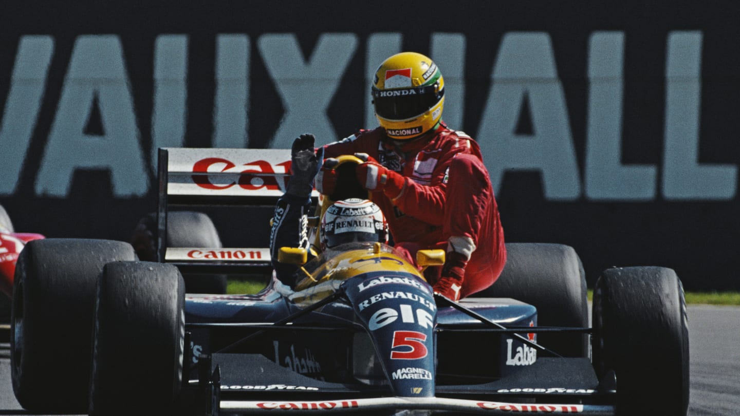 Nigel Mansell driving the #5 Canon Williams Renault Williams FW14 Renault V10 gives Ayrton Senna a