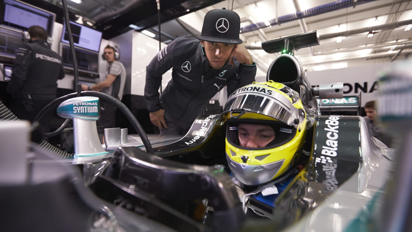 JEREZ DE LA FRONTERA, SPAIN - JANUARY 29:  Lewis Hamilton looks on as Nico Rosberg of Germany and