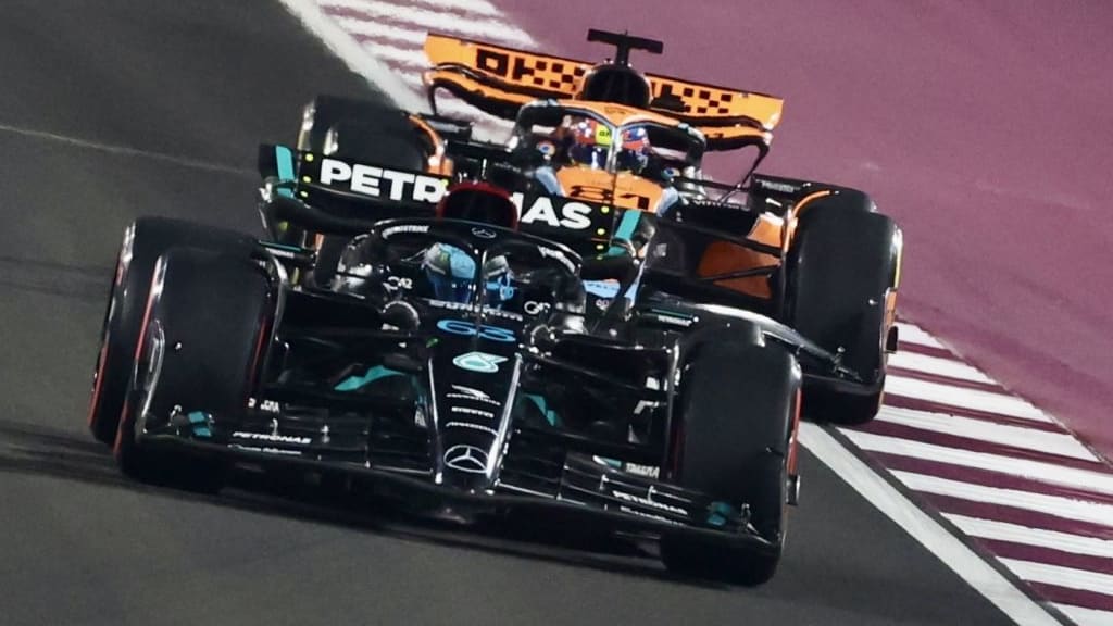 DOHA, QATAR - OCTOBER 07: Oscar Piastri (back) of McLaren and George Russell (front) of Mercedes