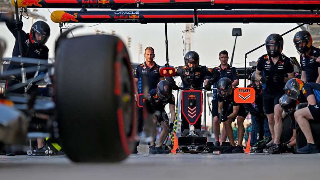 The Red Bull Racing pit crew wait for one of the drivers during the third practice session of the