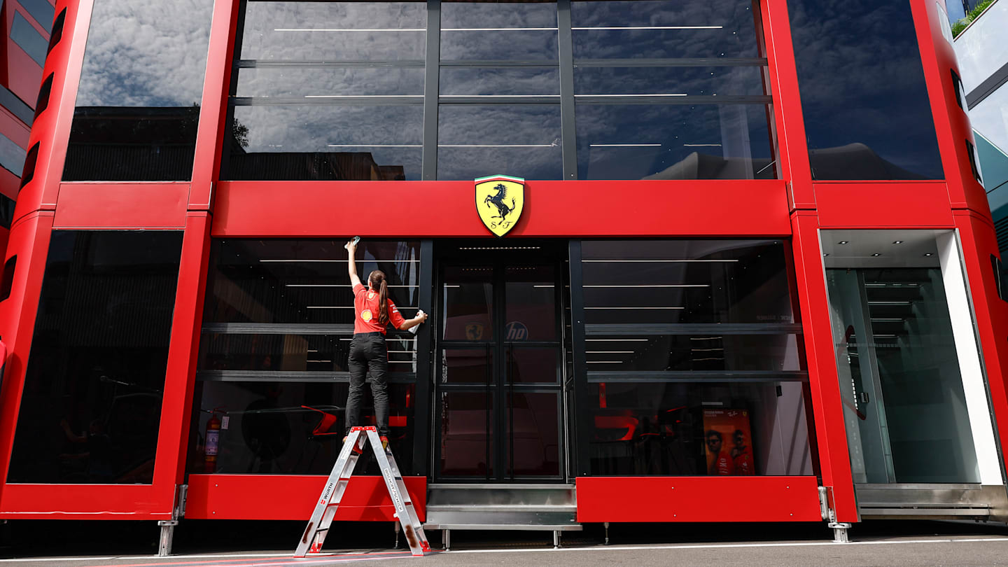 A Ferrari staff member cleans the Ferrari building in the paddock ahead of the Formula One Belgian