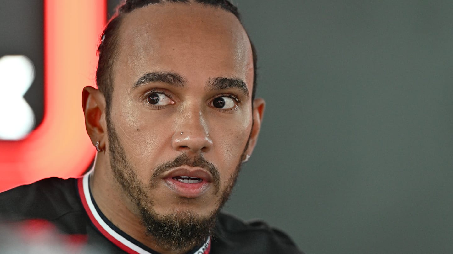 SPA, BELGIUM - JULY 26: Lewis Hamilton of Great Britain and Mercedes walks in the paddock during