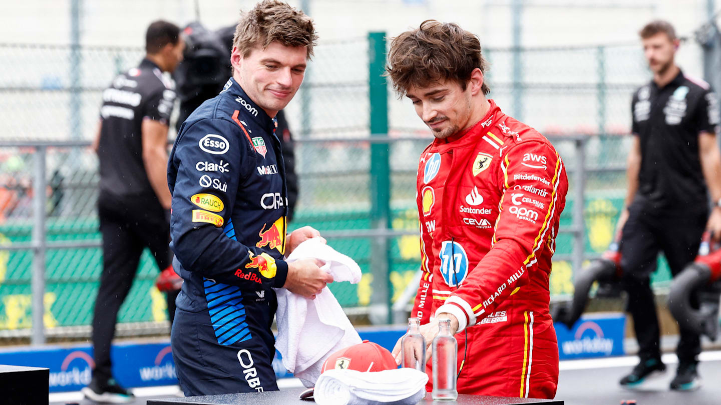 Red Bull Racing's Dutch driver Max Verstappen (L) and Ferrari's Monegasque driver Charles Leclerc