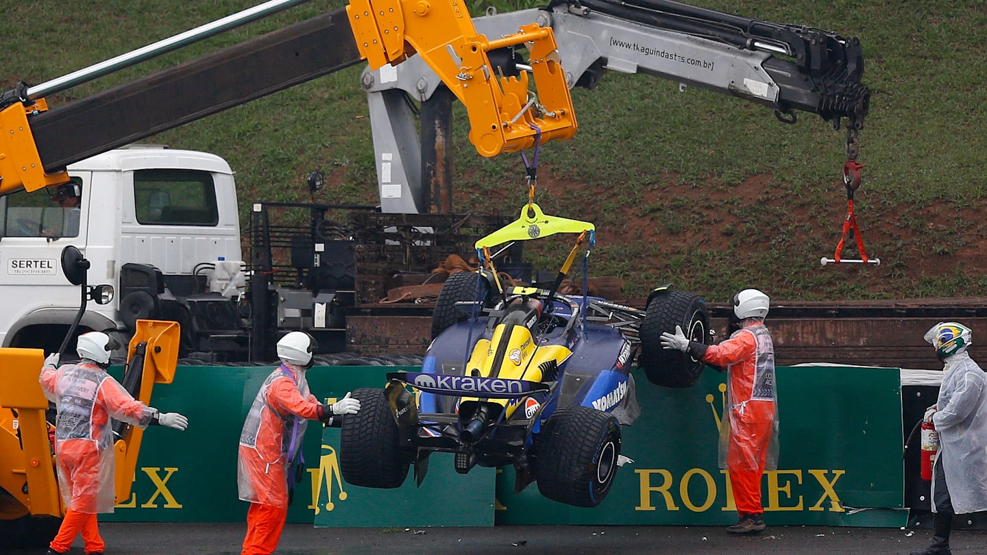 TOPSHOT - The car of Williams' Argentine driver Franco Colapinto is removed from the track after an