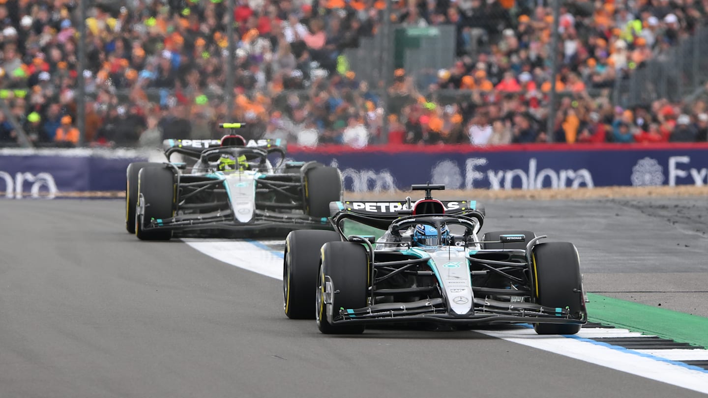 George Russell of Great Britain and Mercedes-AMG Petronas F1 is leading ahead of Lewis Hamilton of