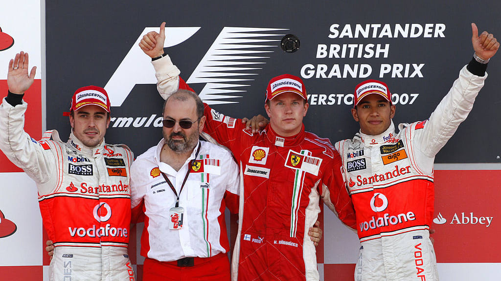 Silverstone, UNITED KINGDOM: (L to R) Spanish McLaren-Mercedes driver Fernando Alonso, Ferrari
