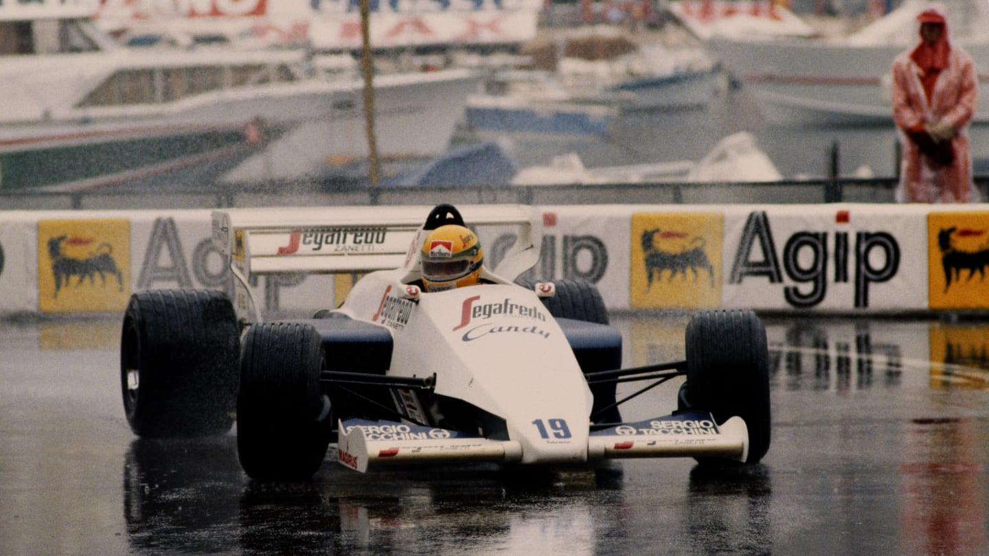 Ayrton Senna of Brazil drives the #19 Toleman-Hart TG184 in the rain to second place during the