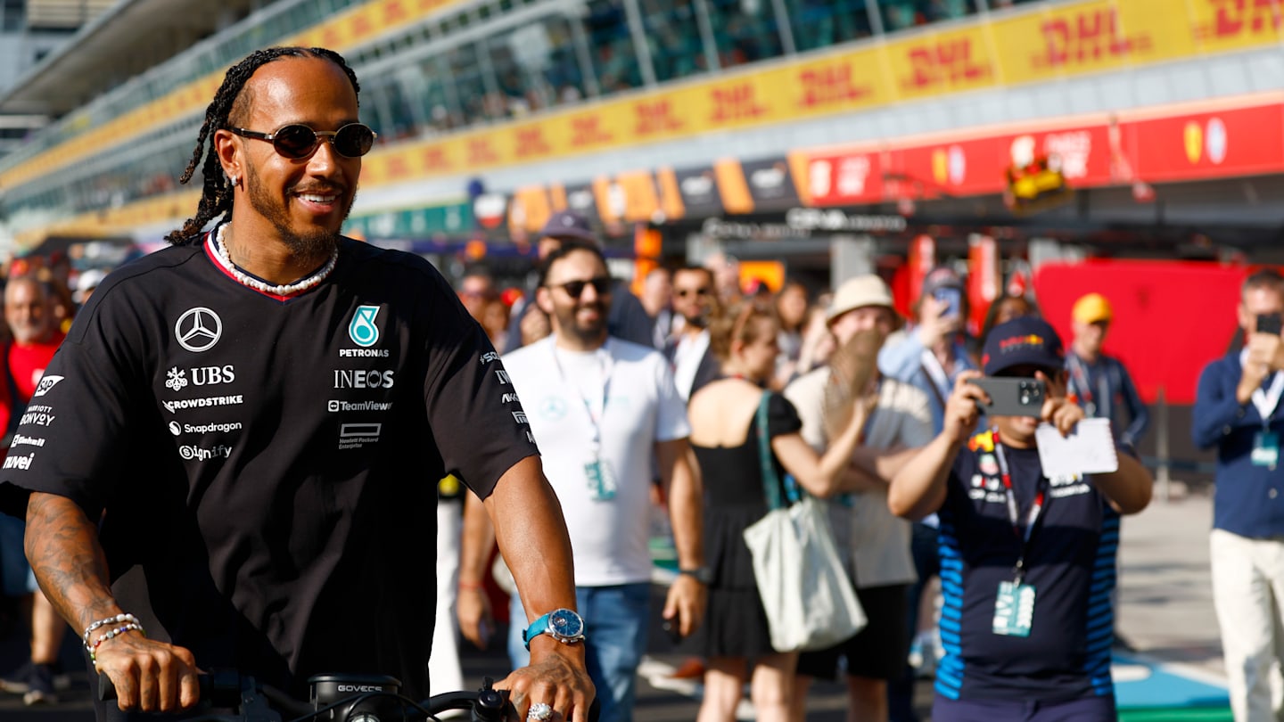 MONZA, ITALY - AUGUST 29: Lewis Hamilton of Great Britain and Mercedes takes a picture with a fan