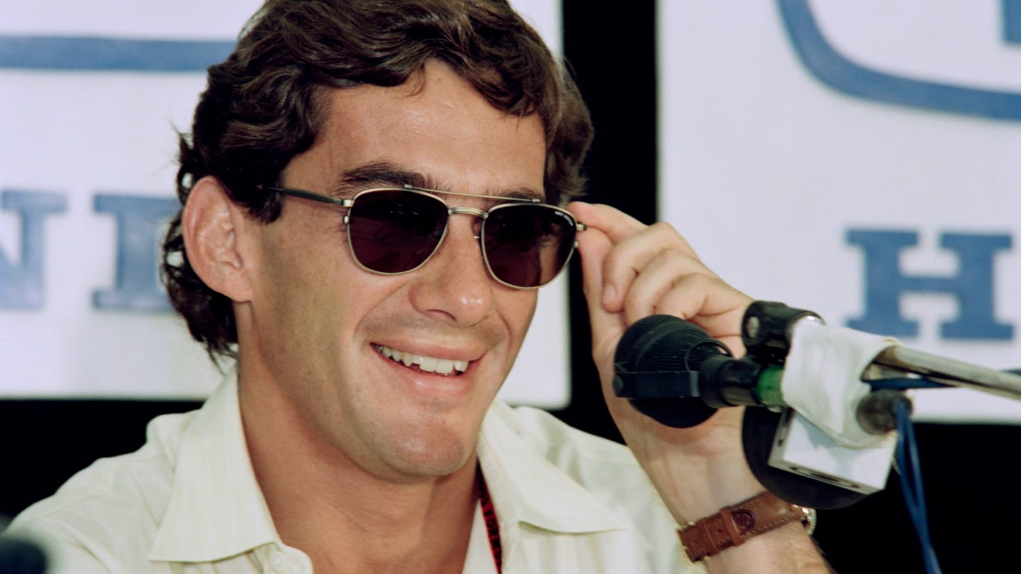 Brazilian Formula One driver Ayrton Senna smiles as he answers newsmen questions during a press