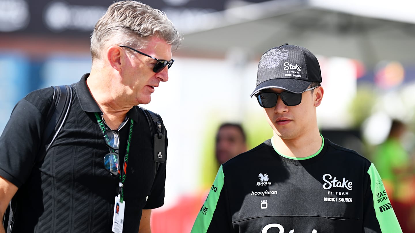 BAKU, AZERBAIJAN - SEPTEMBER 15: Zhou Guanyu of China and Stake F1 Team Kick Sauber talks with