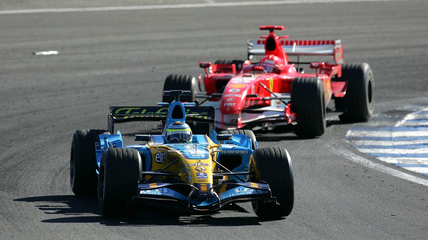 SAO PAULO, BRAZIL - OCTOBER 22:  Giancarlo Fisichella of Italy and Renault leads Michael Schumacher