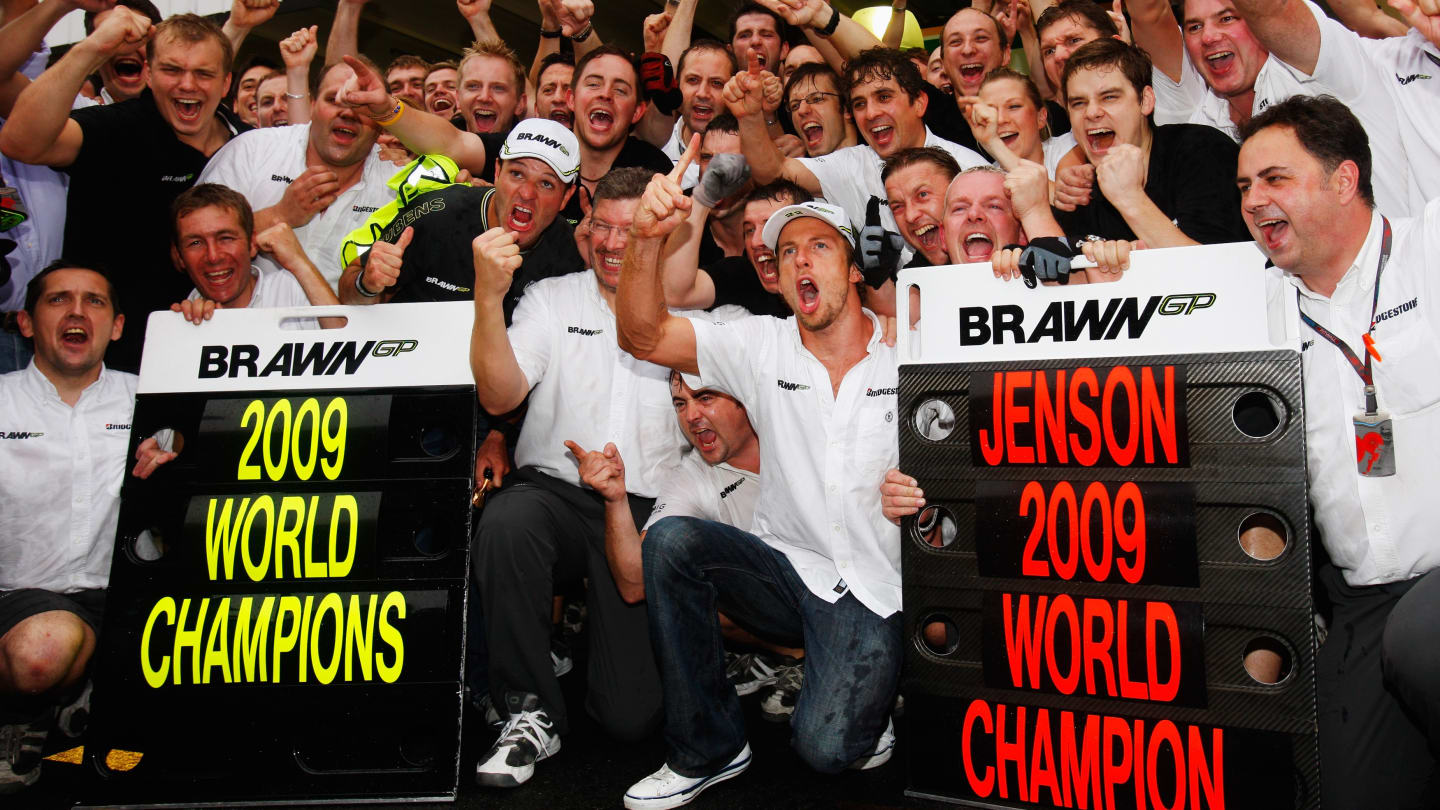 SAO PAULO, BRAZIL - OCTOBER 18:  Jenson Button (C) of Great Britain and Brawn GP celebrates with