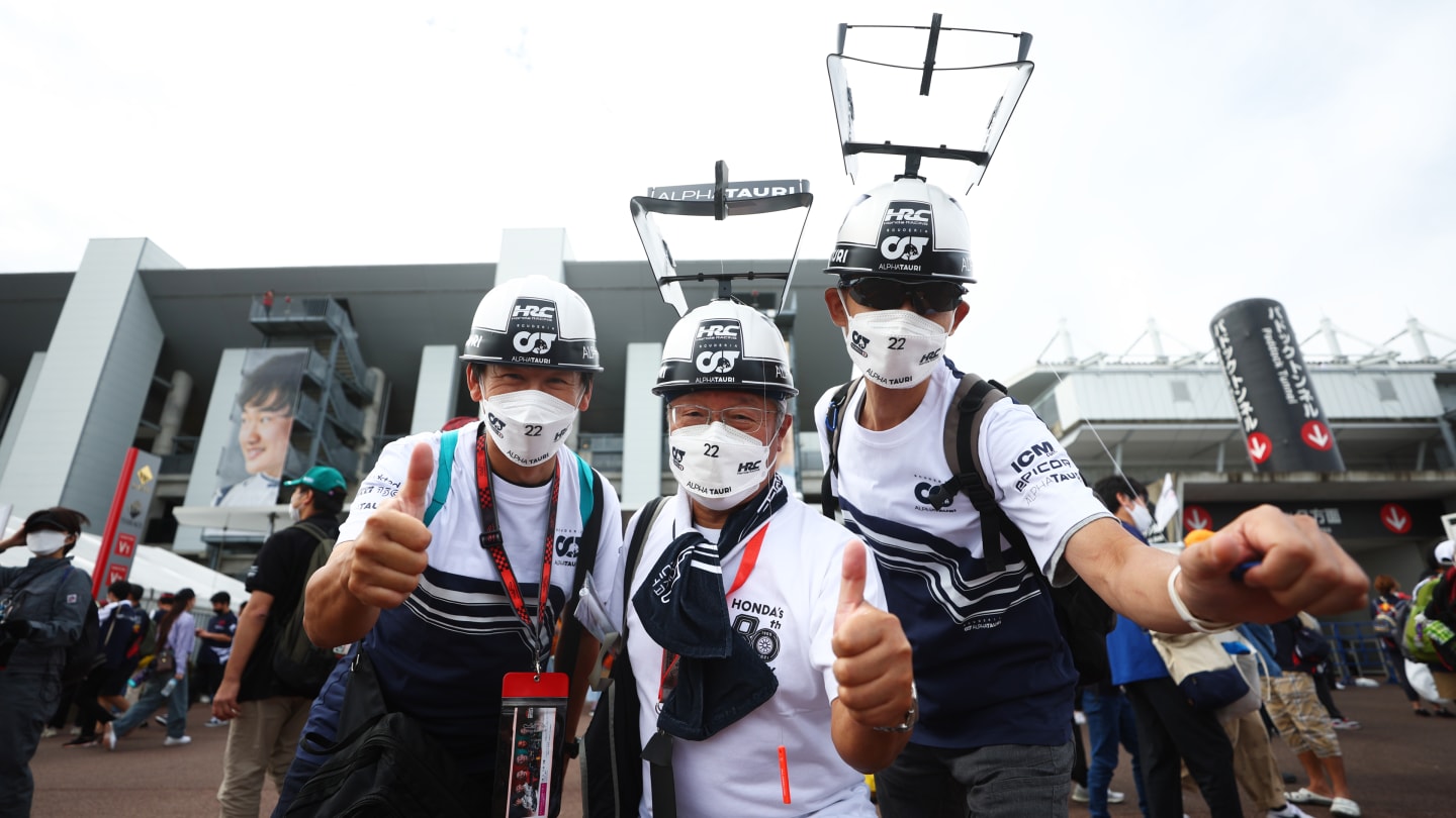 SUZUKA, JAPAN - OCTOBER 08: Scuderia AlphaTauri fans show their support prior to final practice