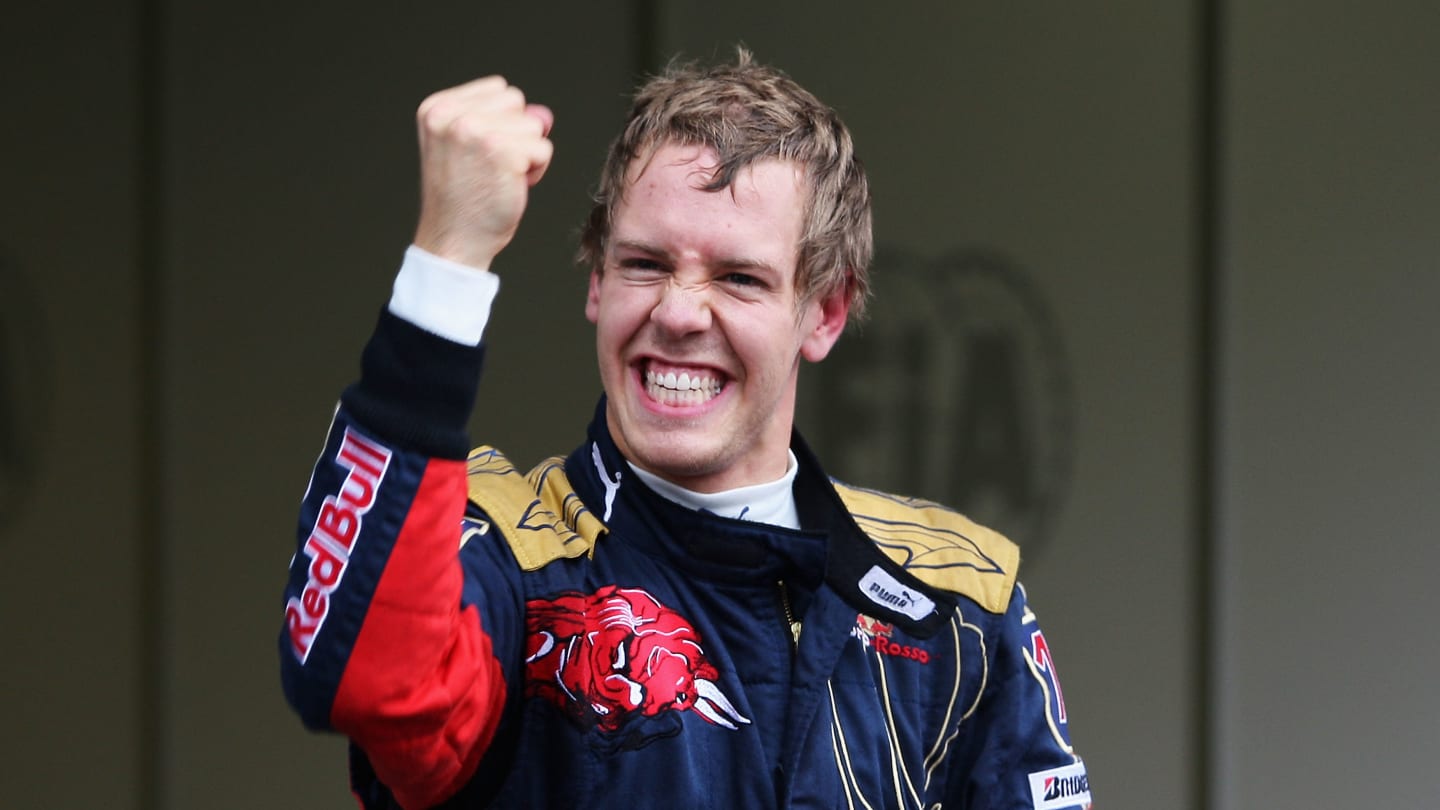 MONZA, ITALY - SEPTEMBER 13:  Sebastian Vettel of Germany and Scuderia Toro Rosso celebrates taking
