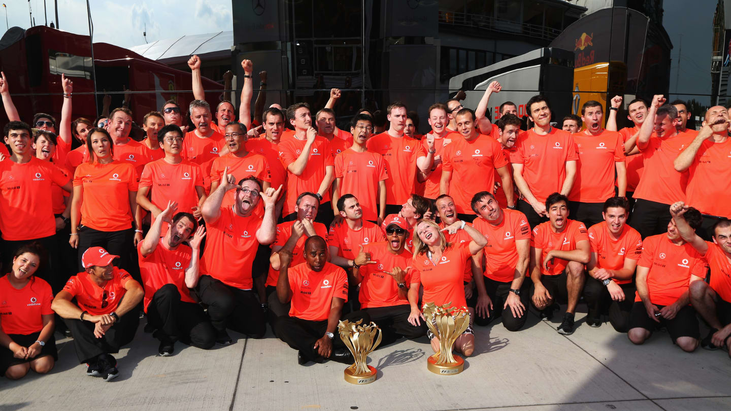 BUDAPEST, HUNGARY - JULY 29:  Lewis Hamilton (C) of Great Britain and McLaren celebrates with his