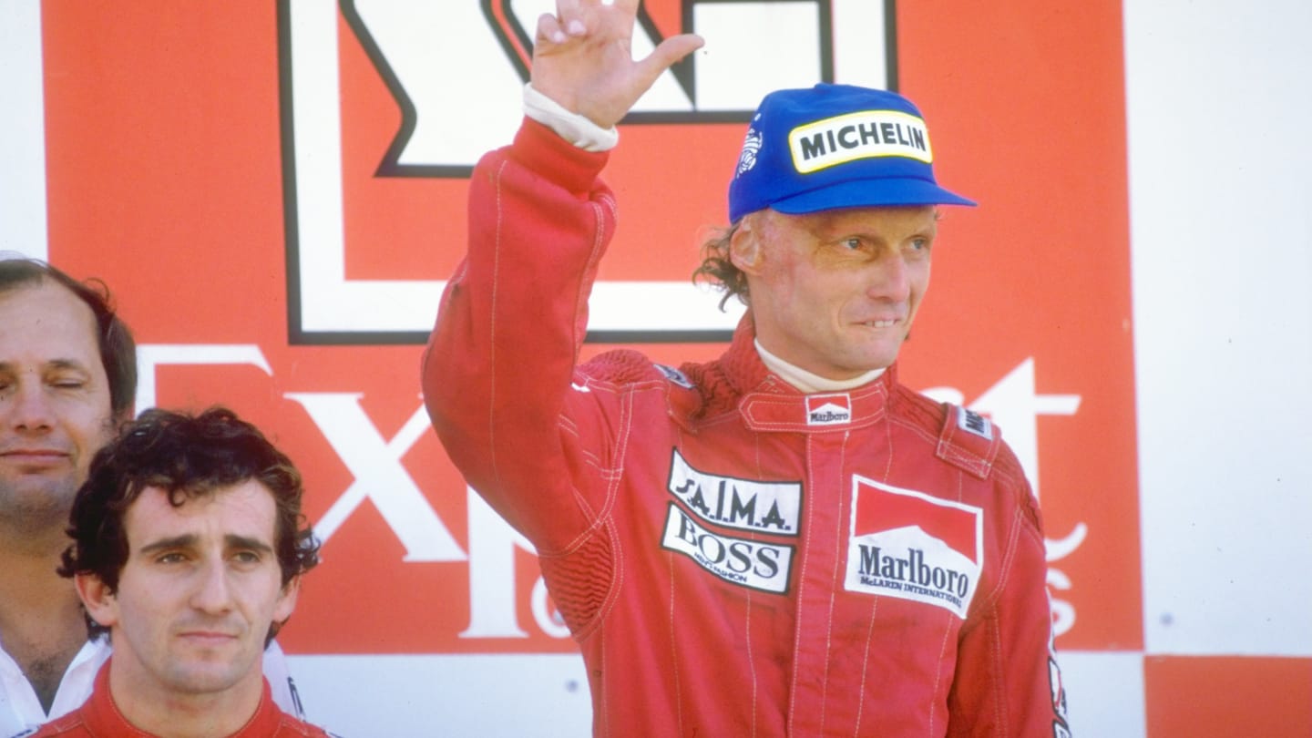 1984:  Marlboro McLaren drivers Alain Prost of France and Niki Lauda of Austria stand on the