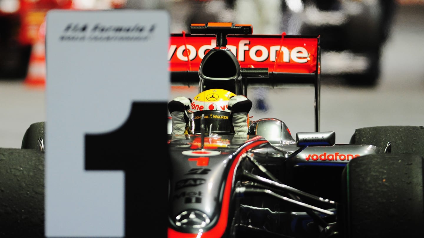 SINGAPORE - SEPTEMBER 27:  Lewis Hamilton of Great Britain and McLaren Mercedes celebrates in parc