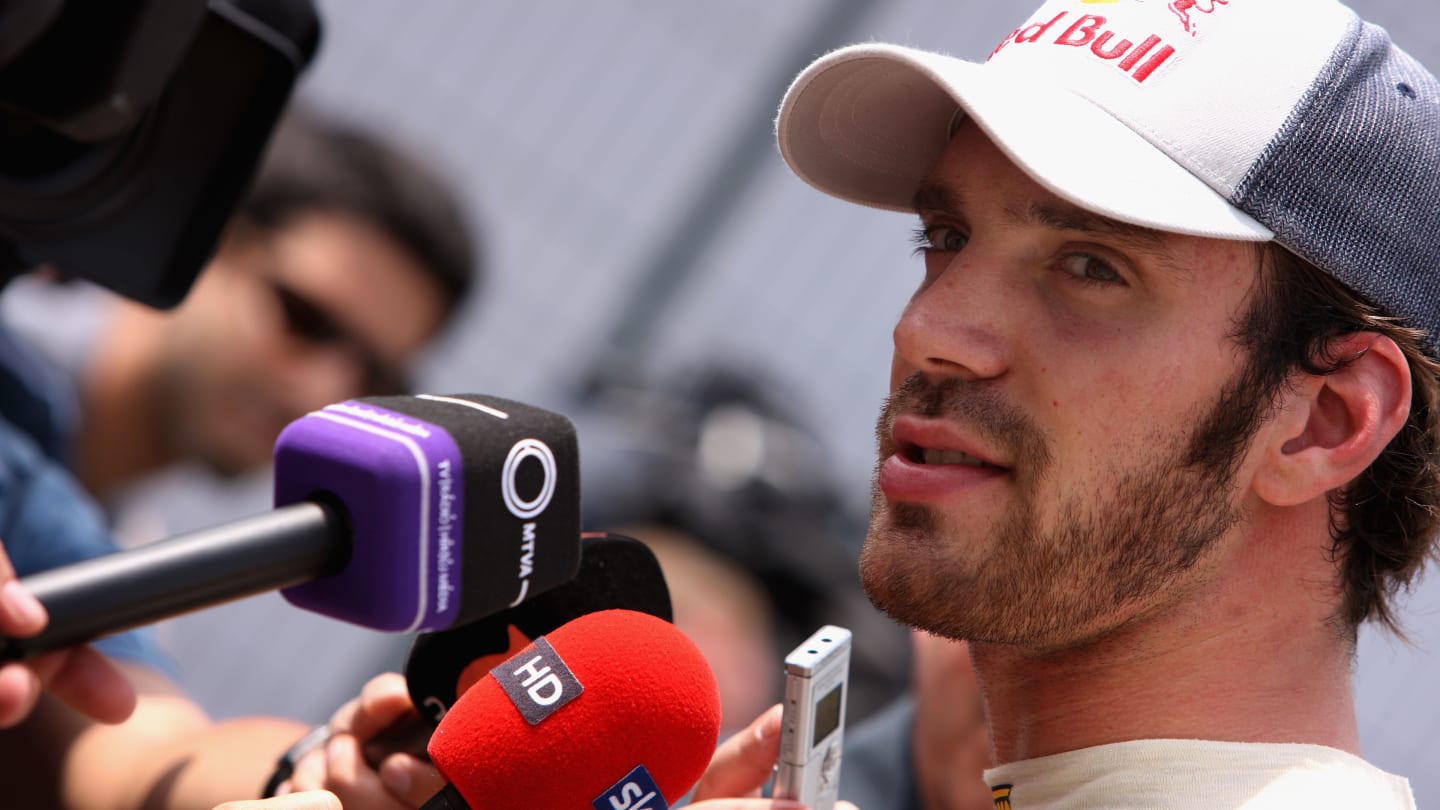 SAO PAULO, BRAZIL - NOVEMBER 24:  Jean-Eric Vergne of France and Scuderia Toro Rosso is interviewed