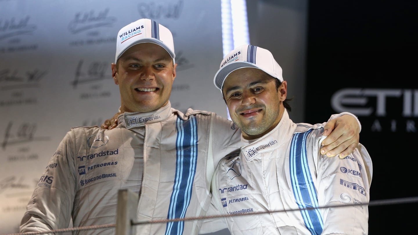 ABU DHABI, UNITED ARAB EMIRATES - NOVEMBER 23:  Valtteri Bottas of Finland and Williams celebrates