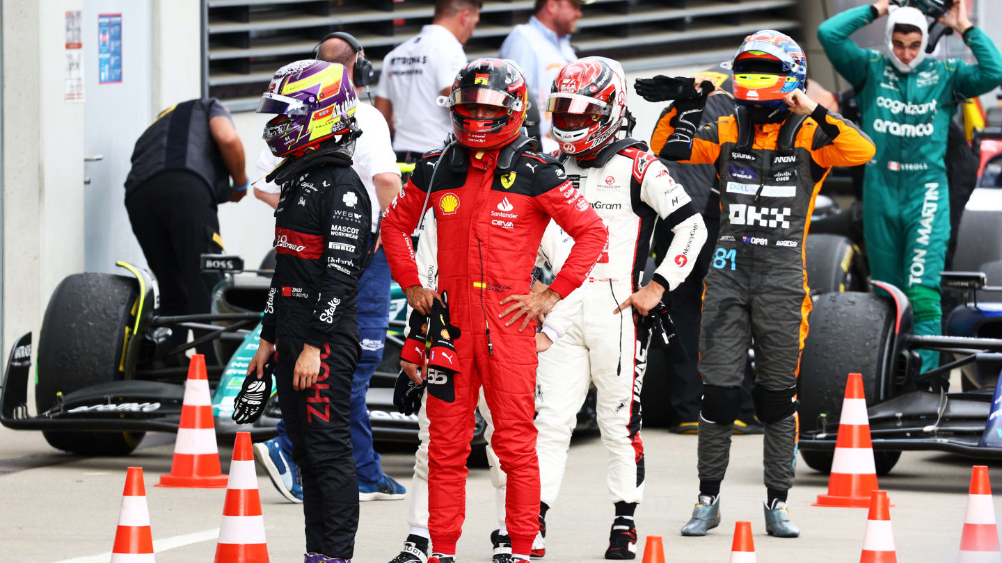 SPIELBERG, AUSTRIA - JULY 02: Zhou Guanyu of China and Alfa Romeo F1, Carlos Sainz of Spain and