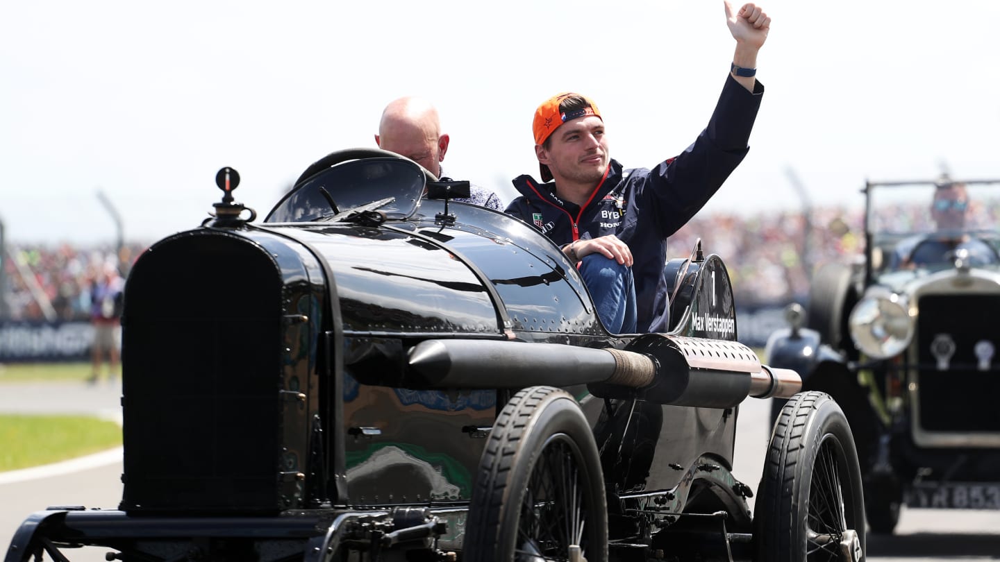 NORTHAMPTON, ENGLAND - JULY 09: Max Verstappen of the Netherlands and Oracle Red Bull Racing waves