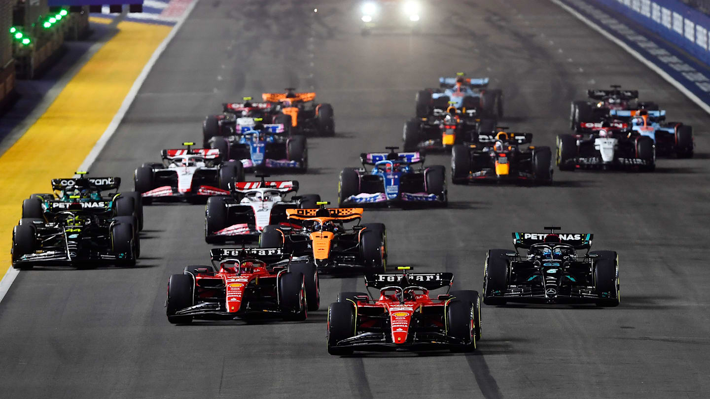 SINGAPORE, SINGAPORE - SEPTEMBER 17: Carlos Sainz of Spain driving (55) the Ferrari SF-23 leads