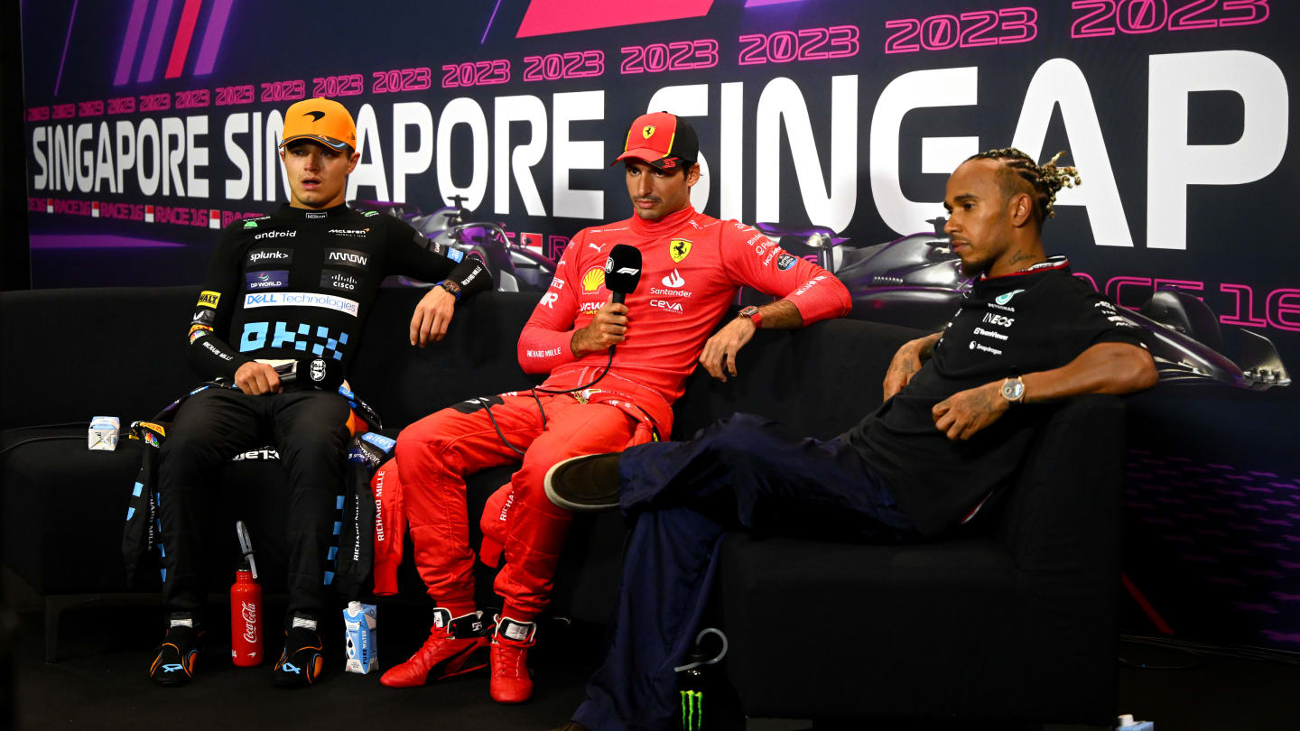 SINGAPORE, SINGAPORE - SEPTEMBER 17: Race winner Carlos Sainz of Spain and Ferrari, Second placed