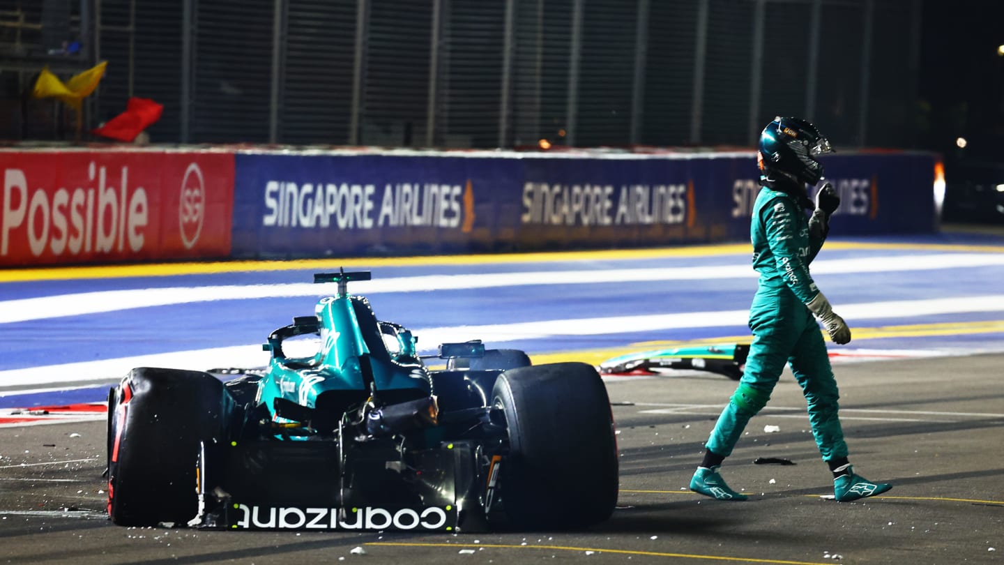 SINGAPORE, SINGAPORE - SEPTEMBER 16: Lance Stroll of Canada and Aston Martin F1 Team walks across