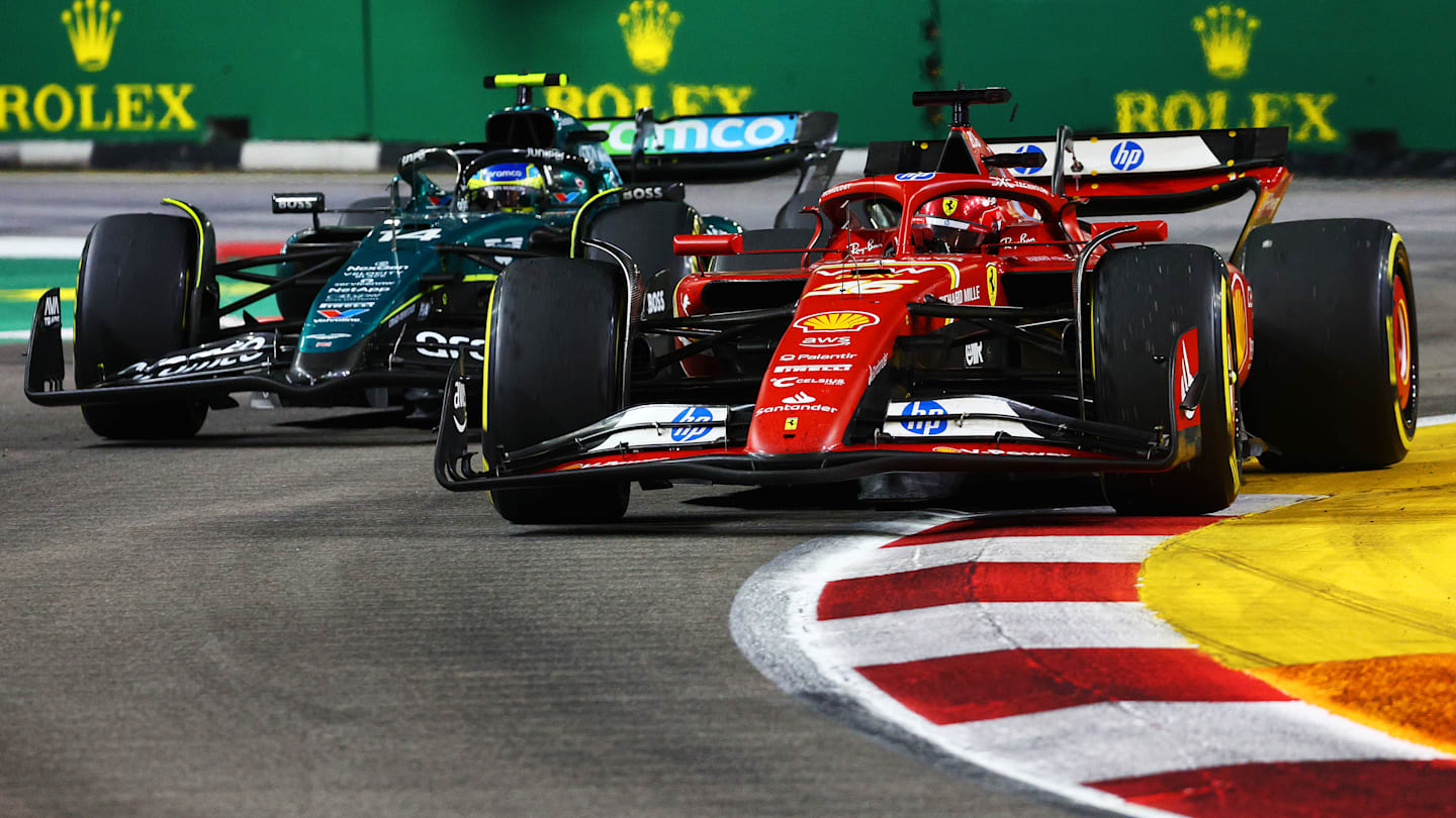 SINGAPORE, SINGAPORE - SEPTEMBER 22: Charles Leclerc of Monaco driving the (16) Ferrari SF-24 leads