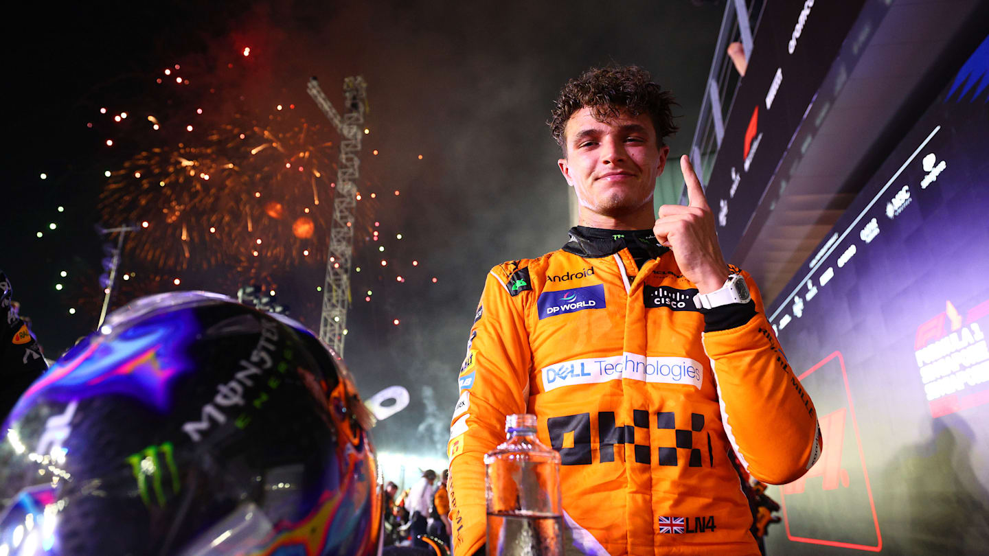 SINGAPORE, SINGAPORE - SEPTEMBER 22: Race winner Lando Norris of Great Britain and McLaren