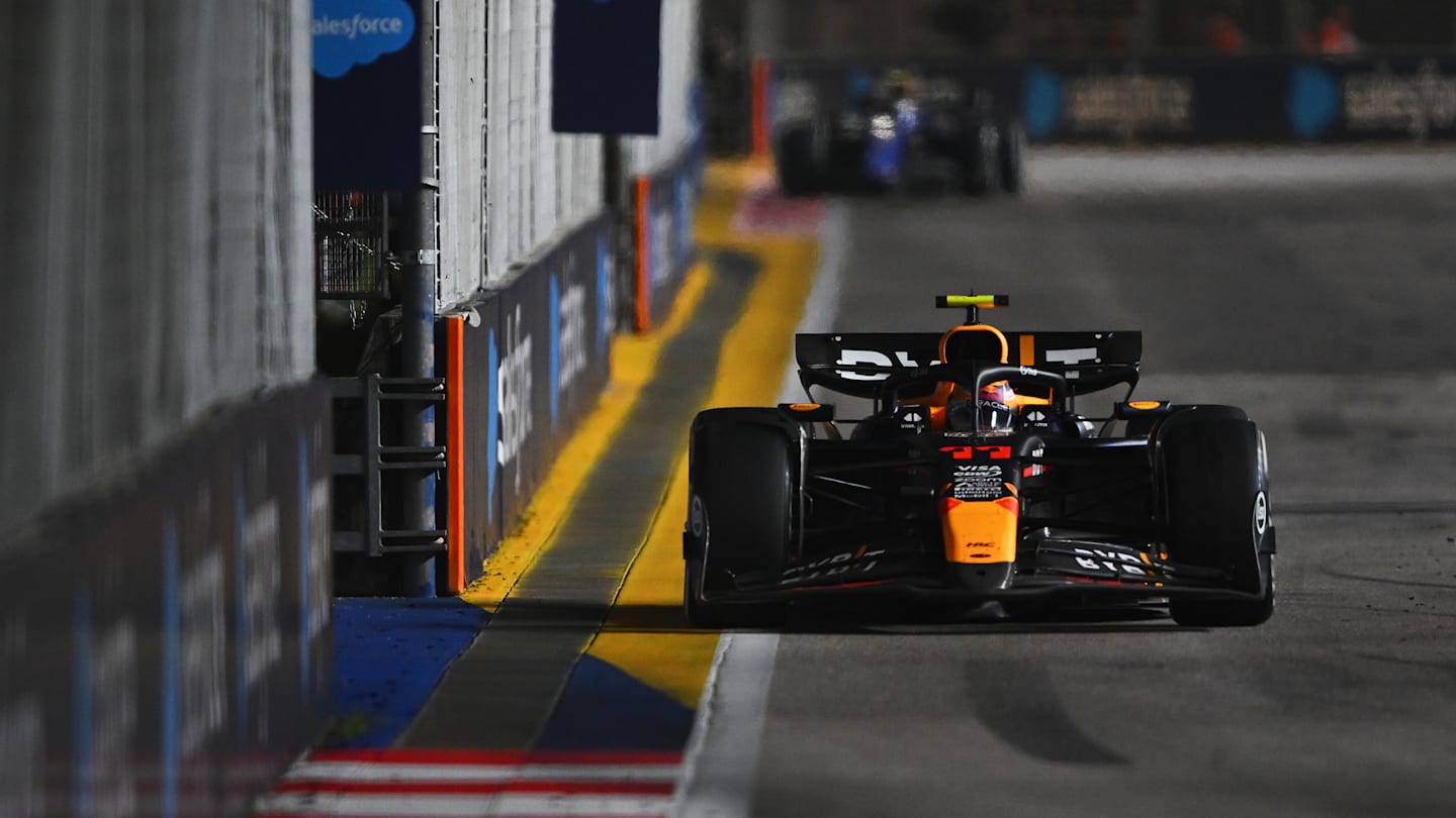 SINGAPORE, SINGAPORE - SEPTEMBER 22: Sergio Perez of Mexico driving the (11) Oracle Red Bull Racing