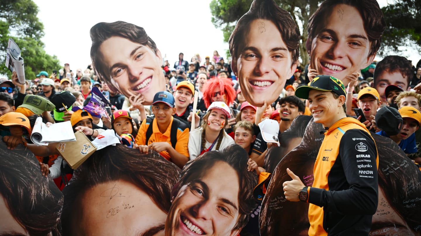 MELBOURNE, AUSTRALIA - MARCH 24: Oscar Piastri of Australia and McLaren greets fans on the