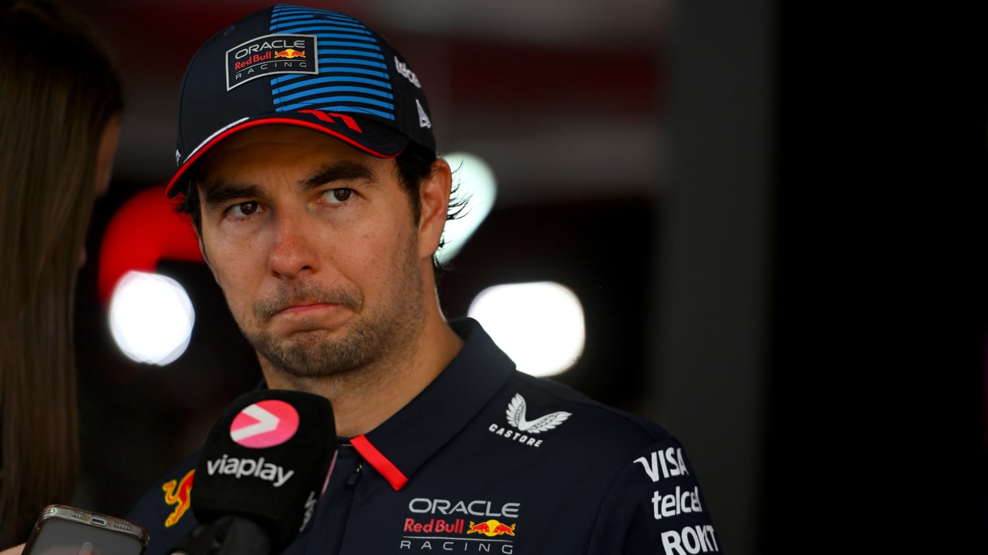 SPIELBERG, AUSTRIA - JUNE 30: 7th placed Sergio Perez of Mexico and Oracle Red Bull Racing talks to