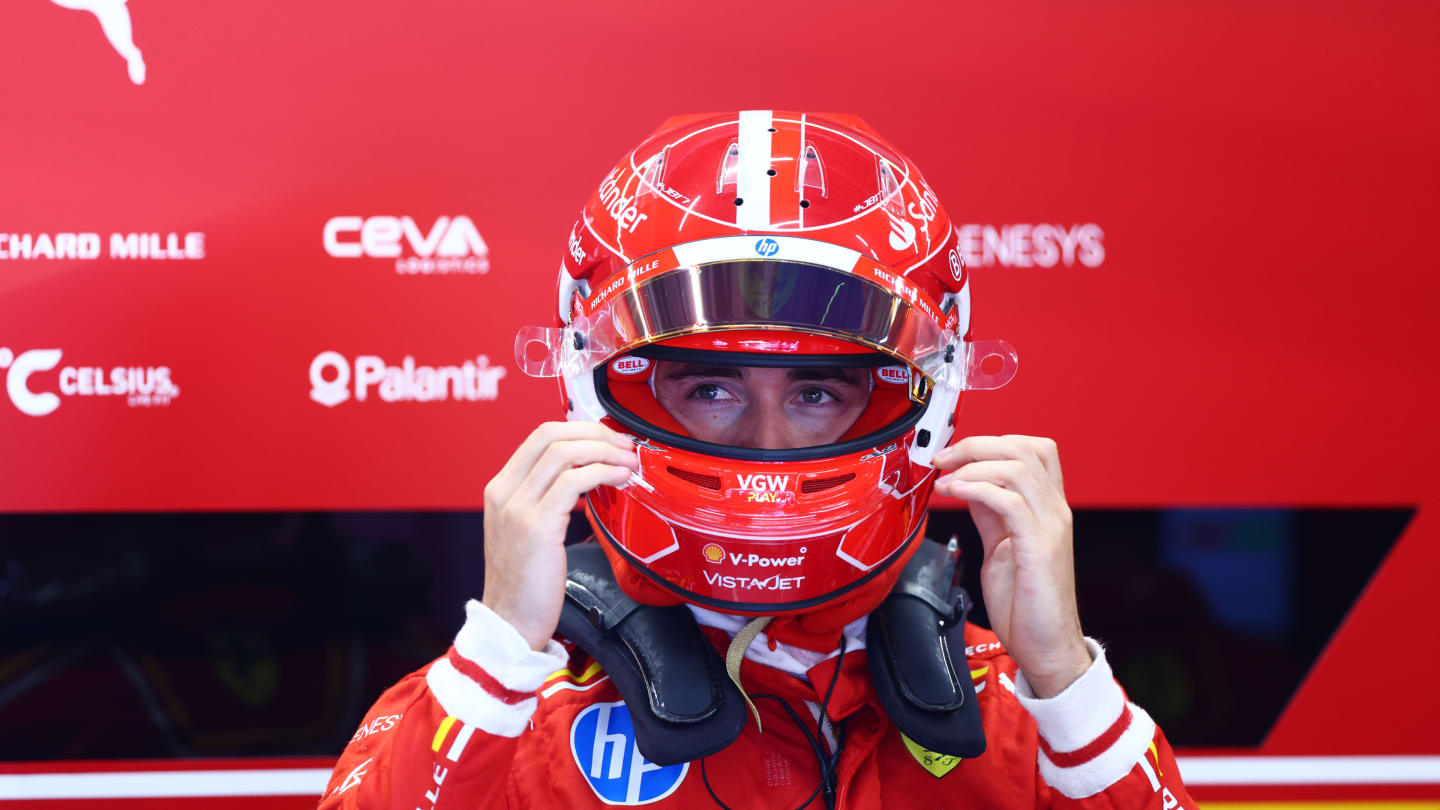 SPIELBERG, AUSTRIA - JUNE 29: Charles Leclerc of Monaco and Ferrari prepares to drive in the garage during qualifying ahead of the F1 Grand Prix of Austria at Red Bull Ring on June 29, 2024 in Spielberg, Austria. (Photo by Bryn Lennon - Formula 1/Formula 1 via Getty Images)