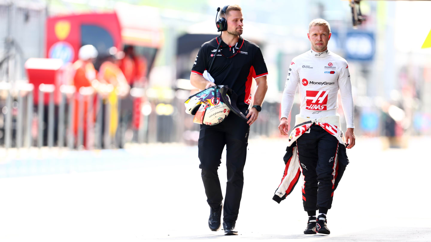 SPIELBERG, AUSTRIA - JUNE 29: 12th placed qualifier Kevin Magnussen of Denmark and Haas F1 walks in the Pitlane during qualifying ahead of the F1 Grand Prix of Austria at Red Bull Ring on June 29, 2024 in Spielberg, Austria. (Photo by Bryn Lennon - Formula 1/Formula 1 via Getty Images)