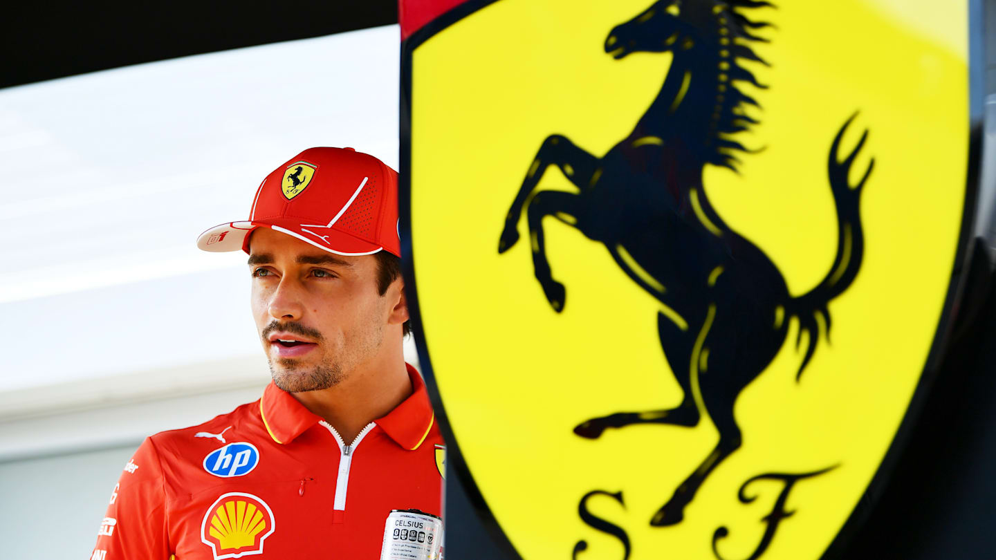 BAKU, AZERBAIJAN - SEPTEMBER 12: Charles Leclerc of Monaco and Ferrari looks on in the Paddock