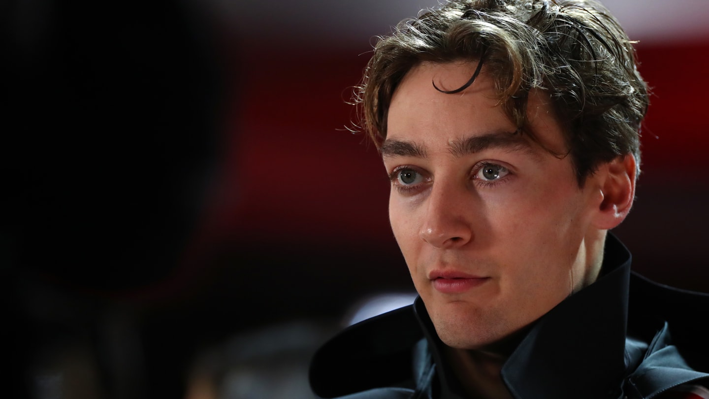 BAHRAIN, BAHRAIN - MARCH 02: George Russell of Great Britain and Mercedes looks on in the Paddock