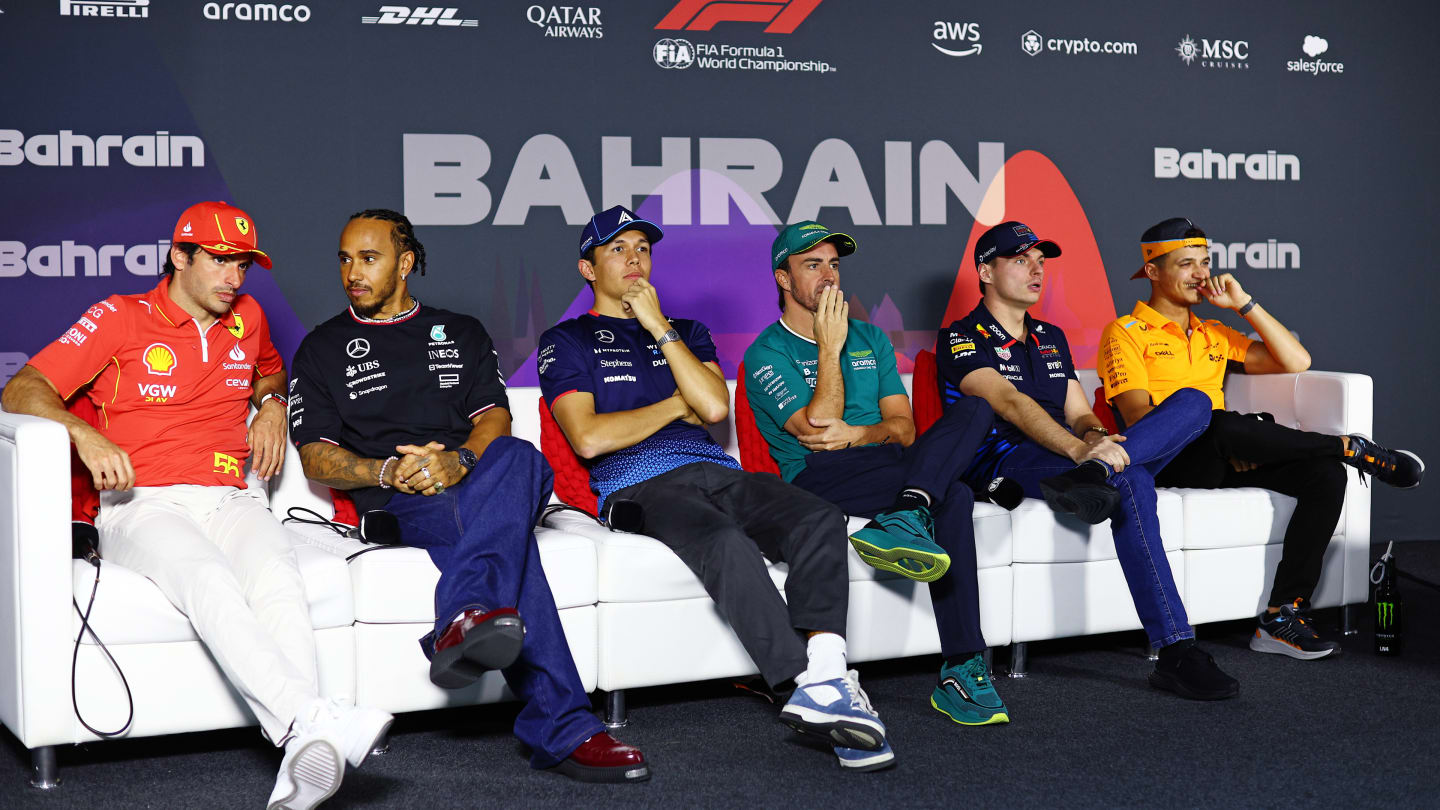 BAHRAIN, BAHRAIN - FEBRUARY 28: (L-R) Carlos Sainz of Spain and Ferrari, Lewis Hamilton of Great