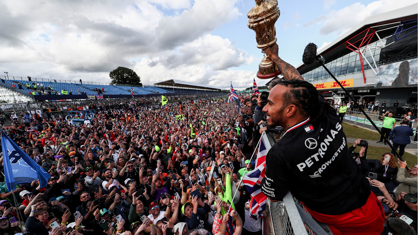 NORTHAMPTON, ENGLAND - JULY 07: Lewis Hamilton of Mercedes and Great Britain celebrates finishing