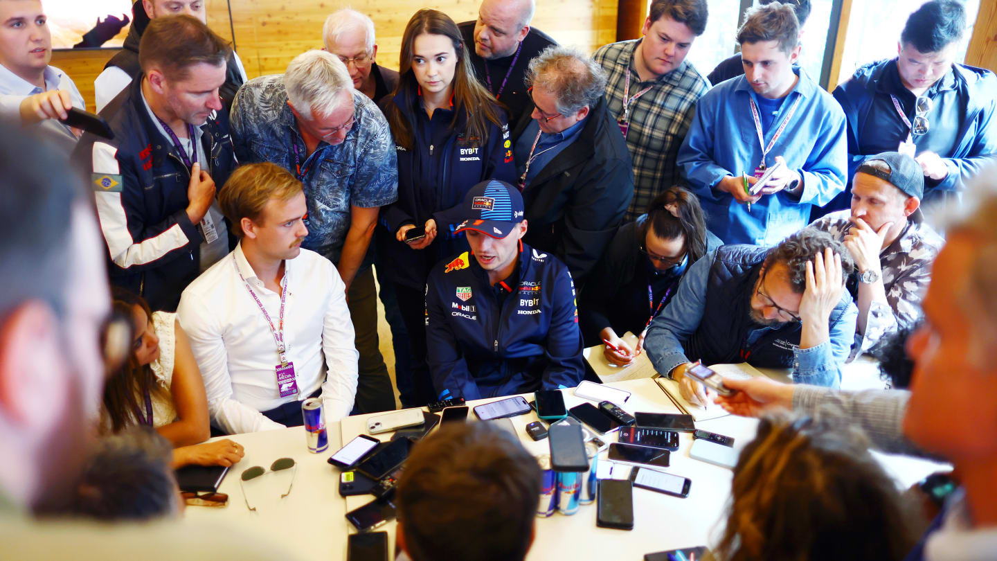 NORTHAMPTON, ENGLAND - JULY 04: Max Verstappen of the Netherlands and Oracle Red Bull Racing talks