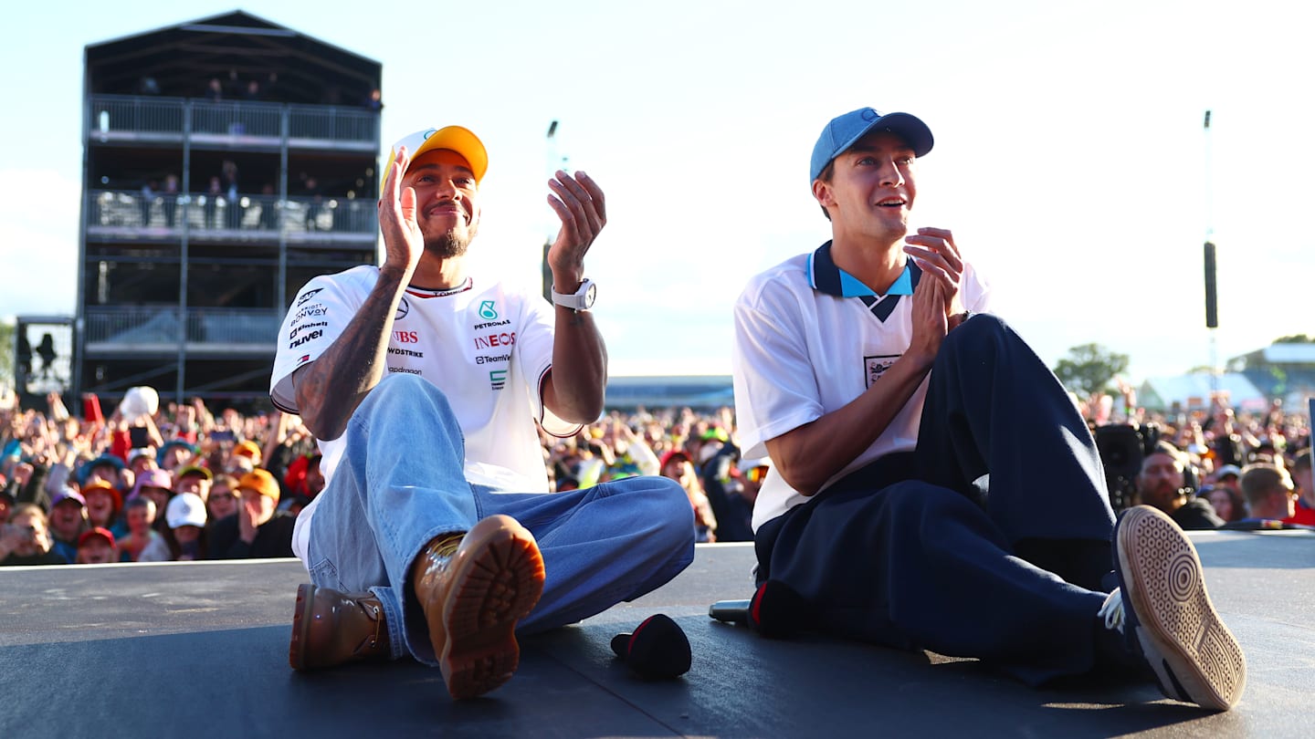 NORTHAMPTON, ENGLAND - JULY 06: Lewis Hamilton of Great Britain and Mercedes and George Russell of