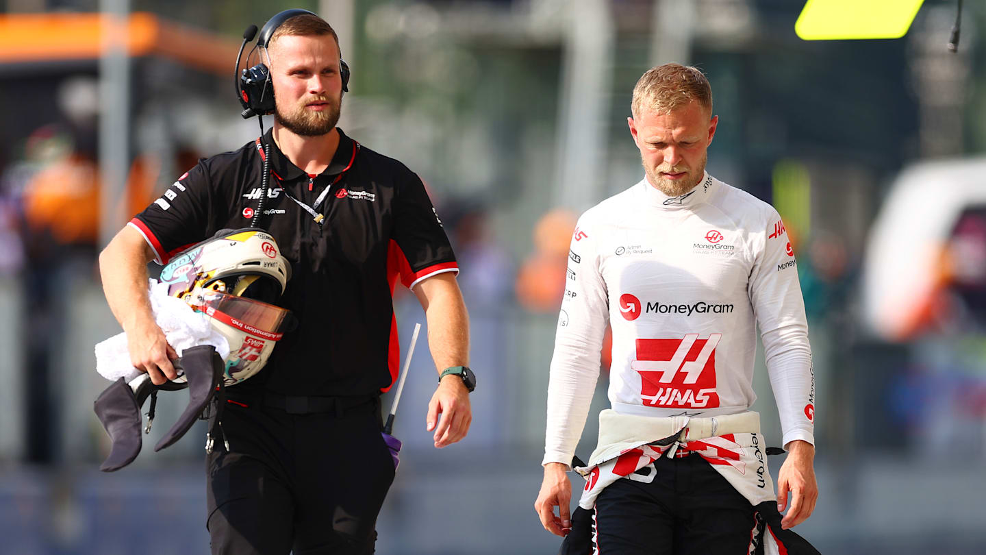 MONZA, ITALY - AUGUST 31: Kevin Magnussen of Denmark and Haas F1 walks in the Pitlane during