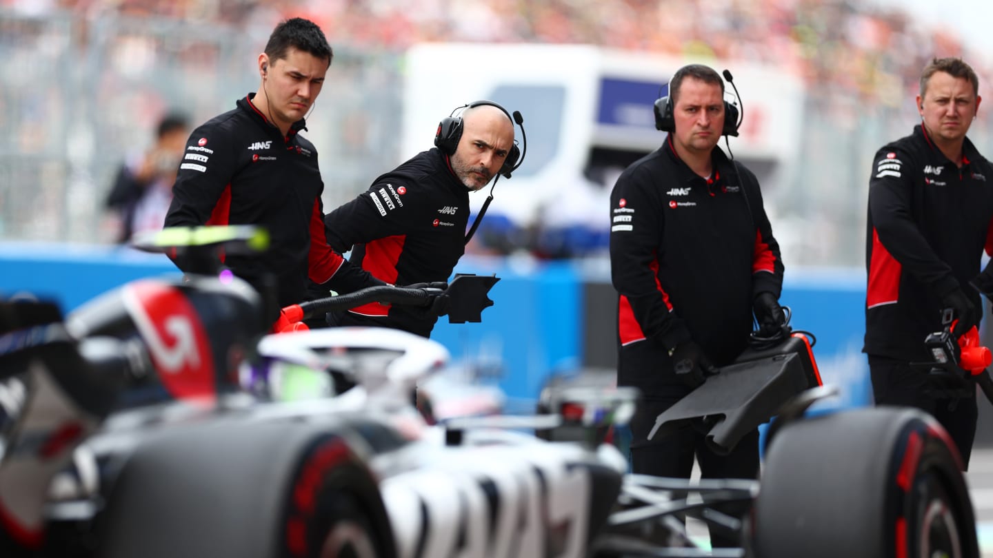 SUZUKA, JAPAN - APRIL 06: The Haas F1 team look on in the Pitlane during qualifying ahead of the F1