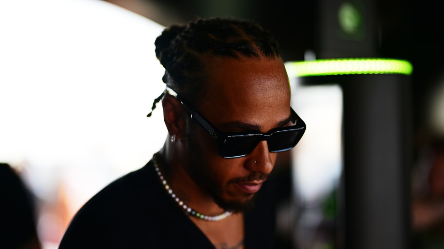 JEDDAH, SAUDI ARABIA - MARCH 07: Lewis Hamilton of Great Britain and Mercedes walks in the Paddock