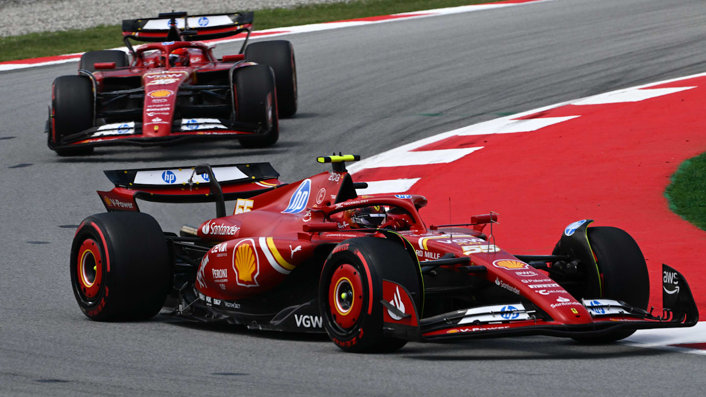 BARCELONA, SPAIN - JUNE 23: Carlos Sainz of Spain driving (55) the Ferrari SF-24 leads Charles