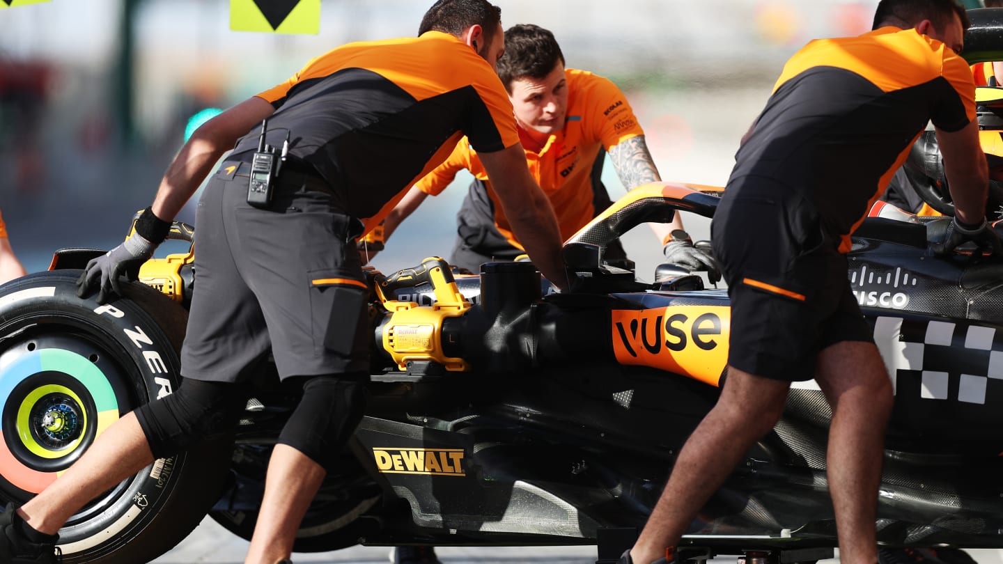 BAHRAIN, BAHRAIN - FEBRUARY 22: The McLaren team work in the Pitlane during day two of F1 Testing