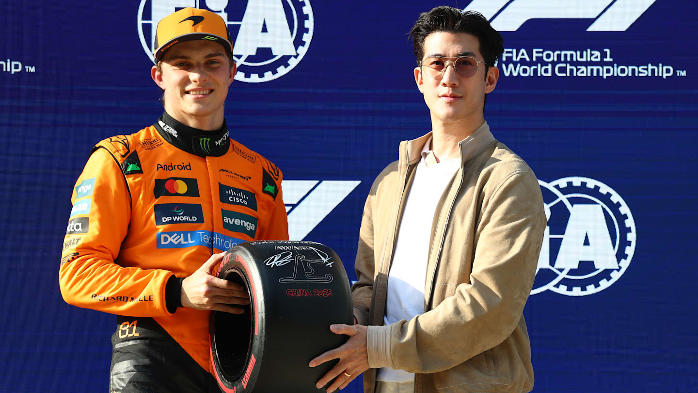 SHANGHAI, CHINA - MARCH 22: Pole position qualifier Oscar Piastri of Australia and McLaren receives