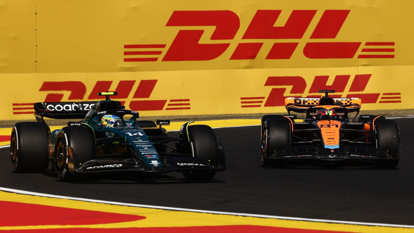 Fernando Alonso of Aston Martin Aramco and Oscar Piastri of McLaren during qualifying ahead of the