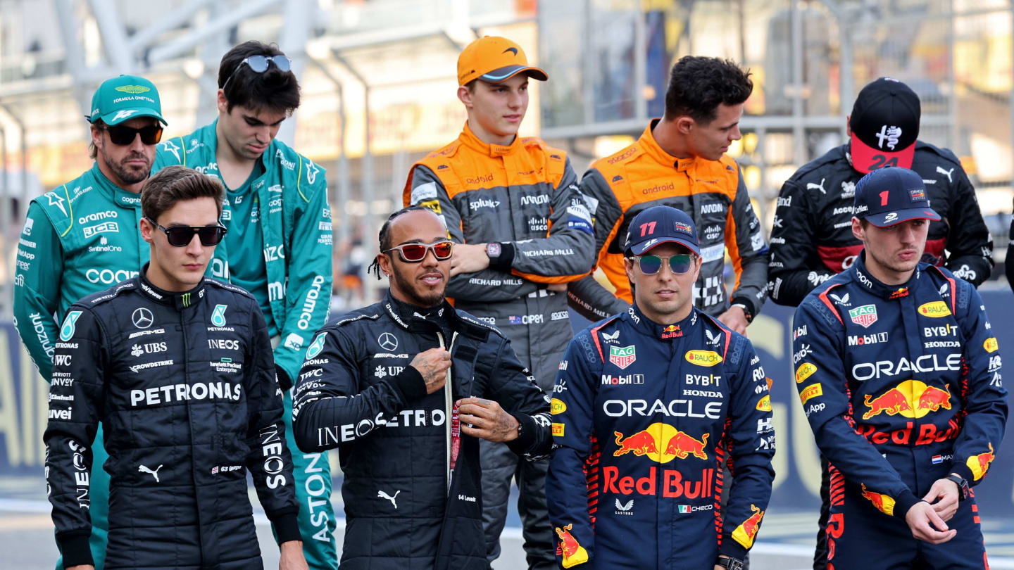 (Front L to R) Mercedes' British driver George Russell and British driver Lewis Hamilton, and Red