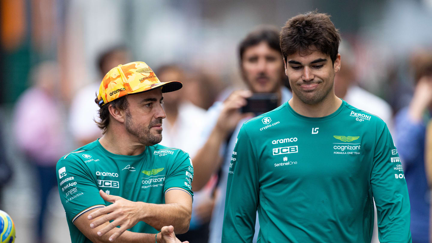 BARCELONA, SPAIN - JUNE 2: Aston Martin F1 team drivers Fernando Alonso and Lance Stroll chat in